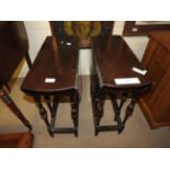 A pair of Edwardian mahogany sutherland tables on turned stretchered supports (2)