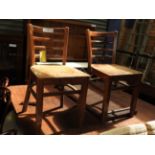 A set of eight French bistro ladder back chairs on stretchered supports (8) (AF)