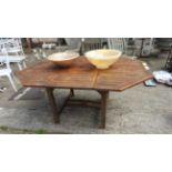 A stained teak octagonal garden table