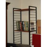 A Ladderax style open bookshelf on black metal ends