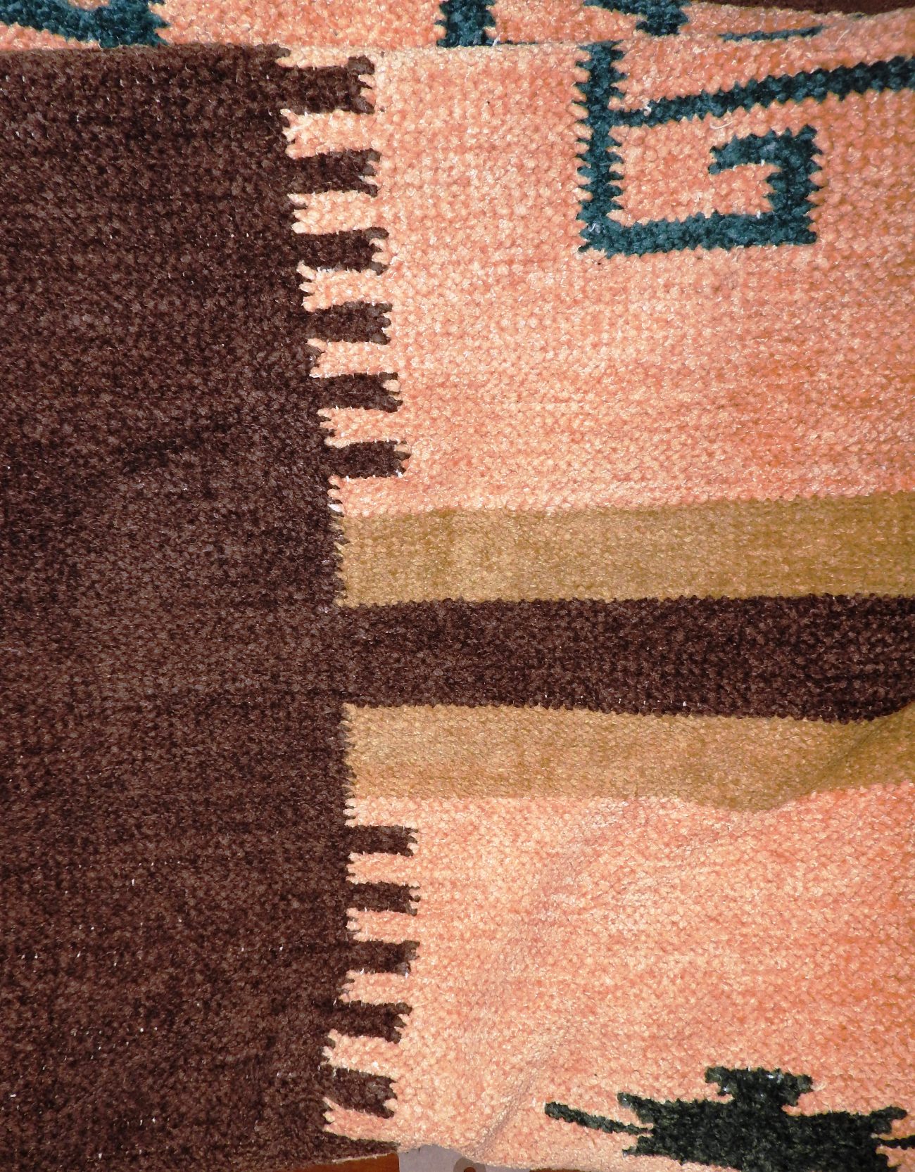 A handmade contemporary Aztec design rug,