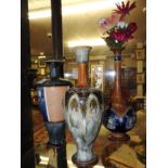 A collection of three Doulton vases