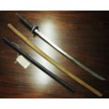 A Samuri style sword and wooden practice sword