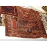 A set of four Persian rugs of varying sizes (4)