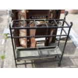 A wrought iron five section stick/umbrella stand