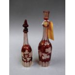 A pair of cranberry glass decanters