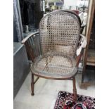 A stickback and wicker tub chair and stool