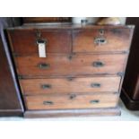 A late 19th century Indian teak campaign style chest of two short over three long drawers raised on