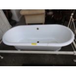 A Victorian design cast iron bath tub on white painted wrought iron supports