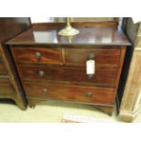 An Edwardian mahogany and inlaid side chest of two short over two long drawers raised on bracket