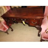 A Georgian design mahogany kneehole writing desk, stamped W Fowkes,