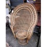 A vintage wicker peacock chair