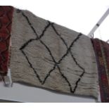 A Morrocan vintage Beni Ourain carpet of loose pile,