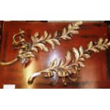 A pair of gilt leaf form triple branch wall sconces