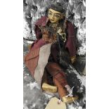 A vintage painted wooden puppet