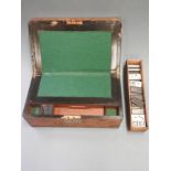 A 19th Century burr walnut writing slope and cased Prisoner of War work dominoes