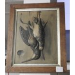 A pair of early 20th Century trompe l'oril relief pictures depicting dead game birds,