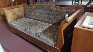 A 19th century French walnut three seater sofa upholstered in floral upholstery (af) raised on