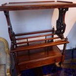 A Victorian walnut Canterbury with pierced ends above three divisions raised on bobbin turned