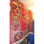 A fine north west Persian Bakhtiar rug 220cm x 130cm central floral medallion on a rouge field