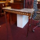 A Continental marble top console table with porcelain plaques and gilt metal mounts.