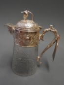 A cut glass and silver plate charger jug with grapevine decoration