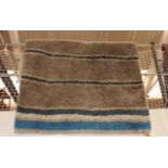 A contemporary Designer's Guild style thick piled rug,