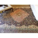 A large Persian Tabriz design rug,