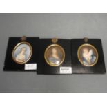 Three portrait miniatures in oval gilded frames and ebonised borders,