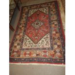 A Persian design rug,