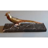 An Art Deco bronze of a pheasant with gi