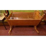 A French fruitwood crib / coffee table w