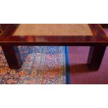 An Oriental lacquered low table having s