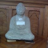 A reconstituted stone seated Buddha