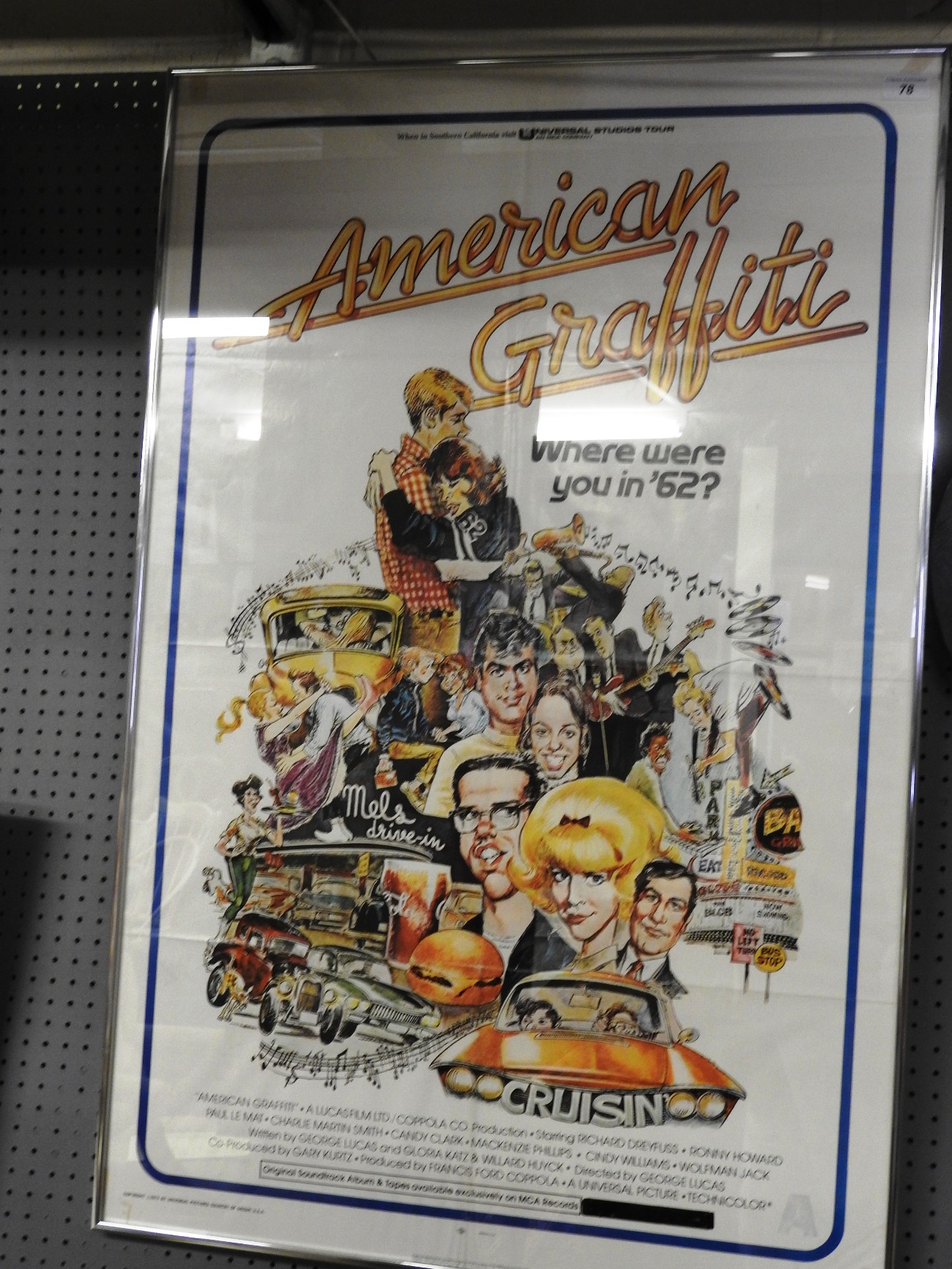 A framed American Graffiti film poster