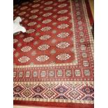 A large Turkoman design carpet, the all