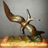 A stylised Art Deco bronze bird on a marble plinth by Charles Garreau,