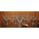 A suite of cut glass drinking goblets,