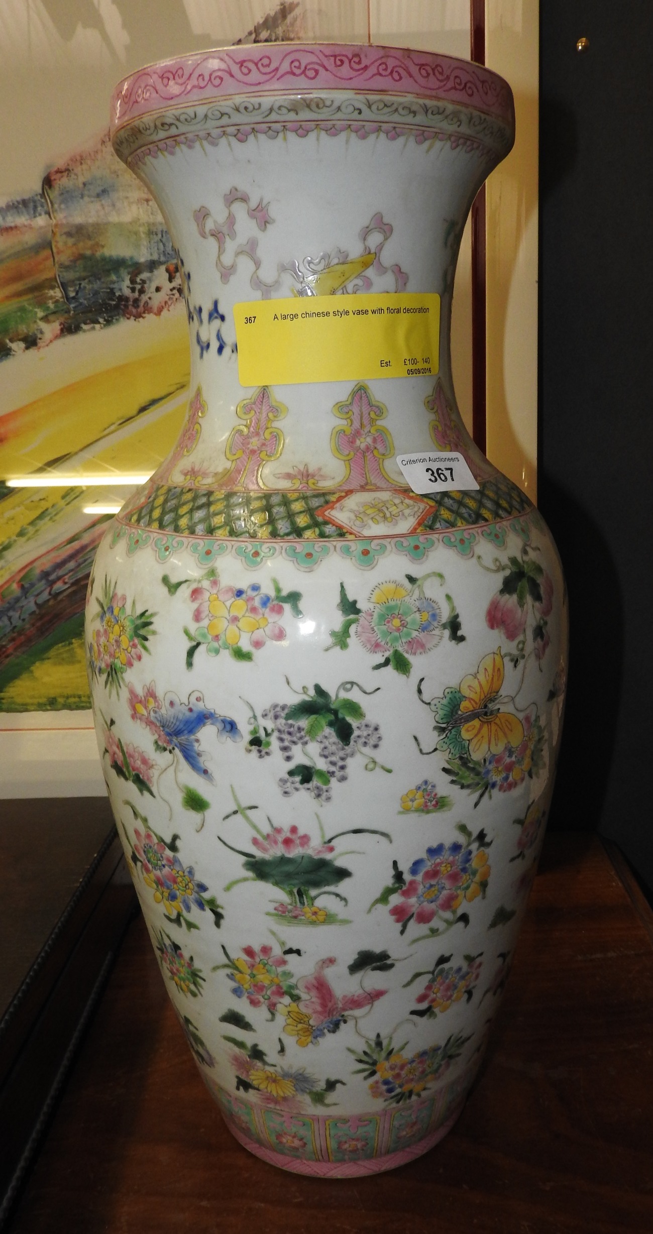 A large chinese style vase with floral decoration