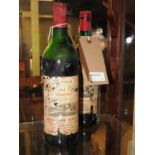 A similar pair of vintage COtes-Canon Fronsac Grand vin bottles of red wine,