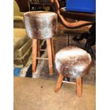 A pair of fur covered stools