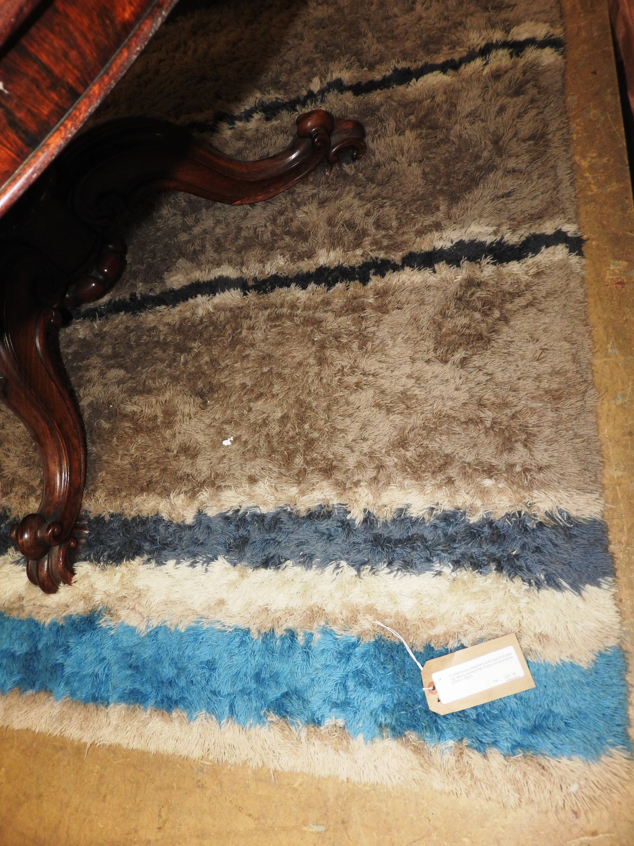 A contemporary Designer's Guild style thick piled rug,
