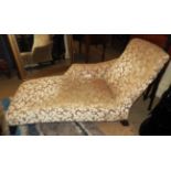 A floral upholstered Chaise Longue on outsplayed ebonised legs