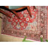 An antique Persian kashan rug,