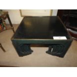 A black and green Chinese style laquered nest of seven tables