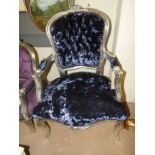 A silvered feauteul upholstered in blue button back fabric