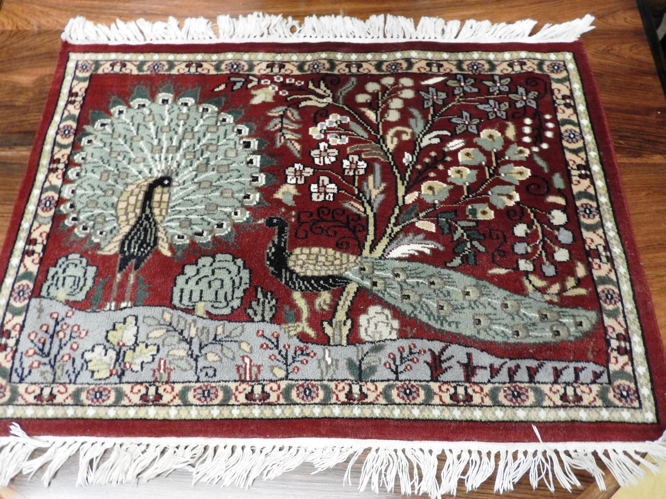 A handmade rug of small proportions,