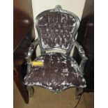 A grey painted and upholstered button back armchair