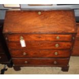 A George III Bureau with fall front and fitted interior over four graduated drawers on bracket feet