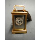 WITHDRAWN - A miniature brass carriage clock